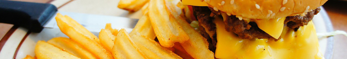 Eating Burger at Giant Burger restaurant in Rhome, TX.